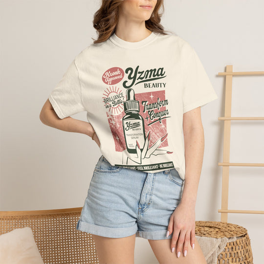 Yzma's Beauty Supply Tee in Ivory worn by a woman in denim shorts, hand on hip, retro beauty ad print
