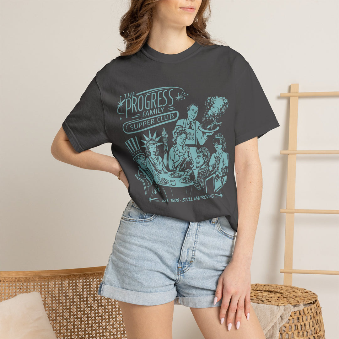 Carousel of Progress Supper Club Tee in Graphite worn by a woman in denim shorts, front view of the light blue print