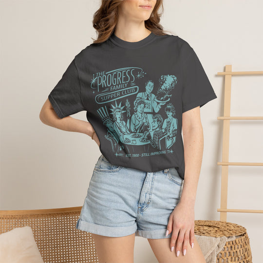 Carousel of Progress Supper Club Tee in Graphite worn by a woman in denim shorts, front view of the light blue print