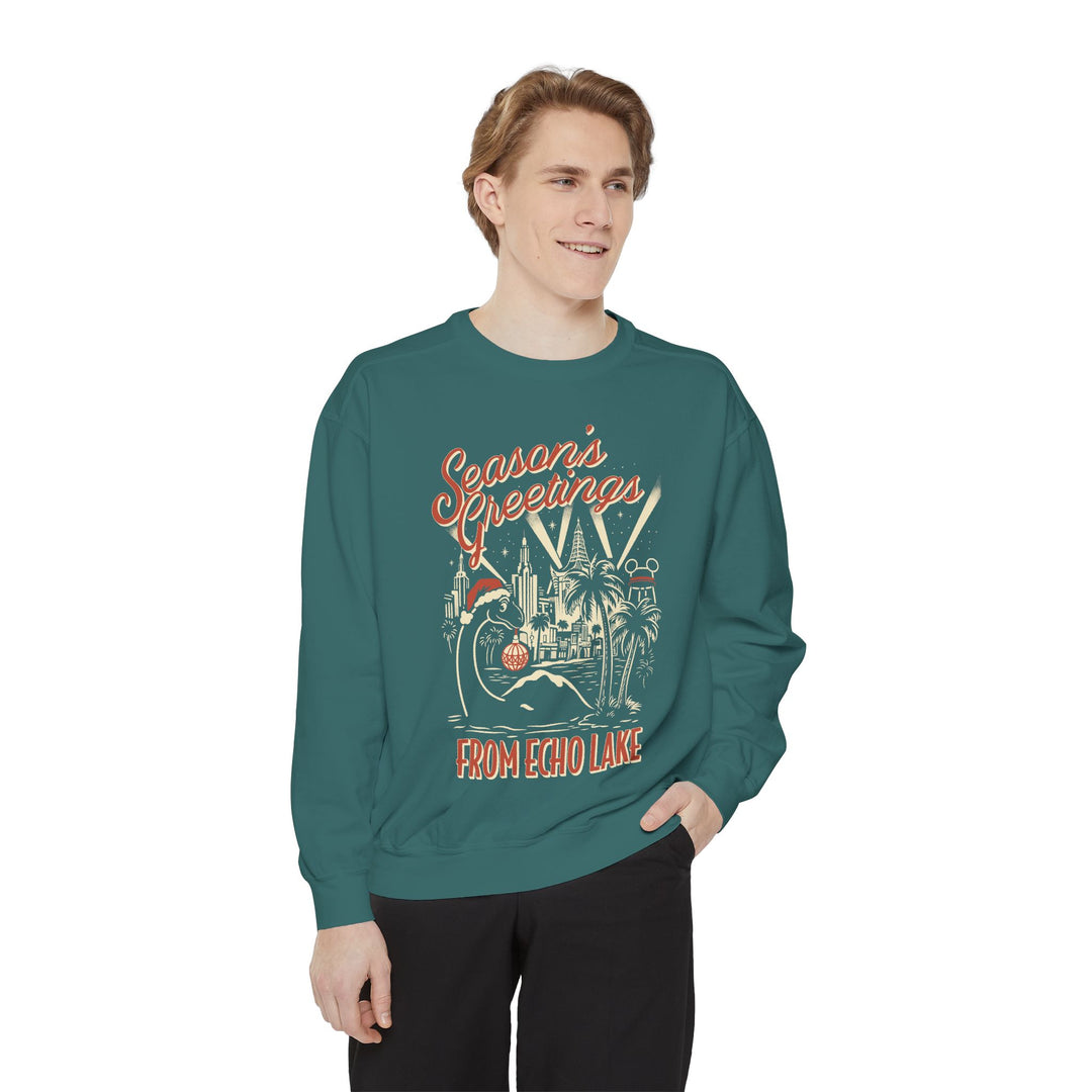 Seasons Greetings from Echo Lake Sweatshirt in Blue Spruce worn by a man, front view of the holiday Gertie print