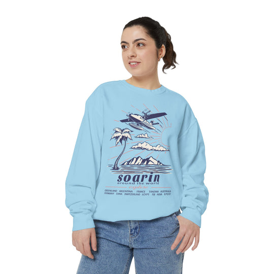 Soarin' Sweatshirt in Chambray worn by a woman in jeans looking to the side, front view of the hang glider design