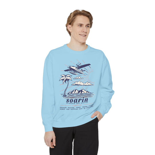 Soarin' Sweatshirt in Chambray worn by a man with a hand in his pocket, front view of the Soarin print