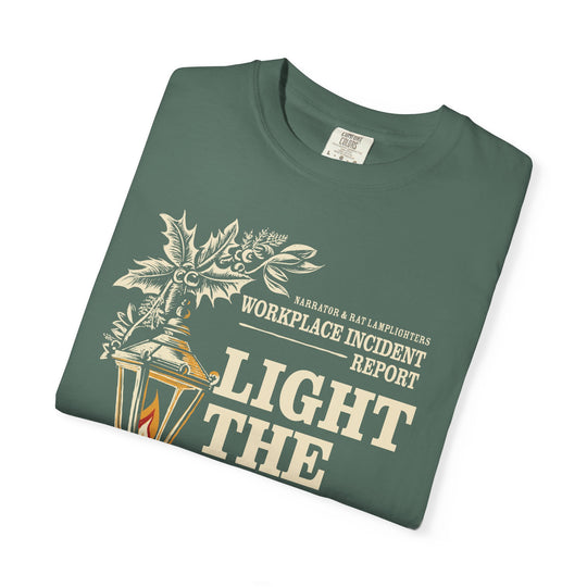 Light the Lamp, Not the Rat Christmas Shirt in Blue Spruce, folded close-up of the lamp and Workplace Incident Report text