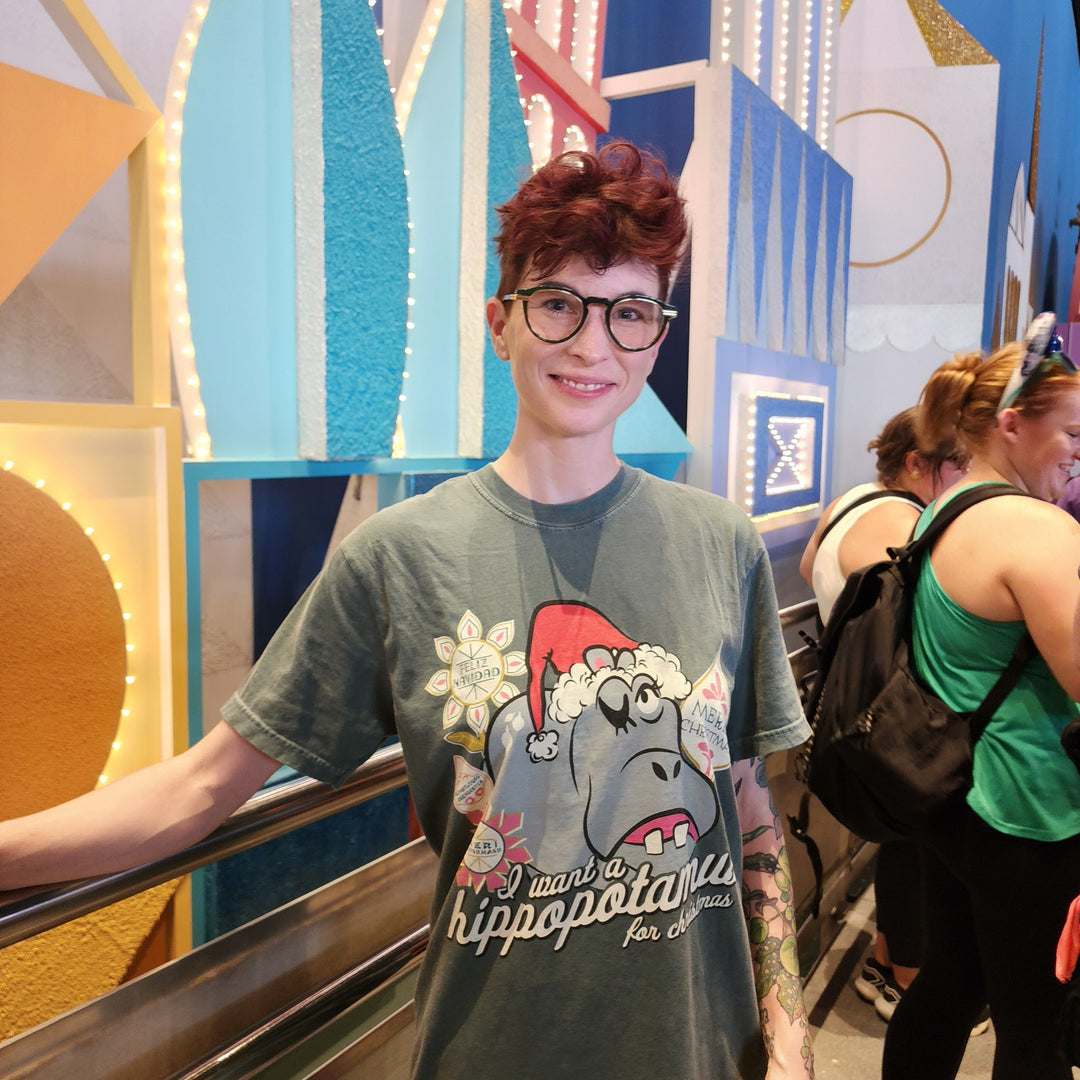 Kylie wearing the I Want a Hippopotamus for Christmas Shirt in Blue Spruce inside it&
