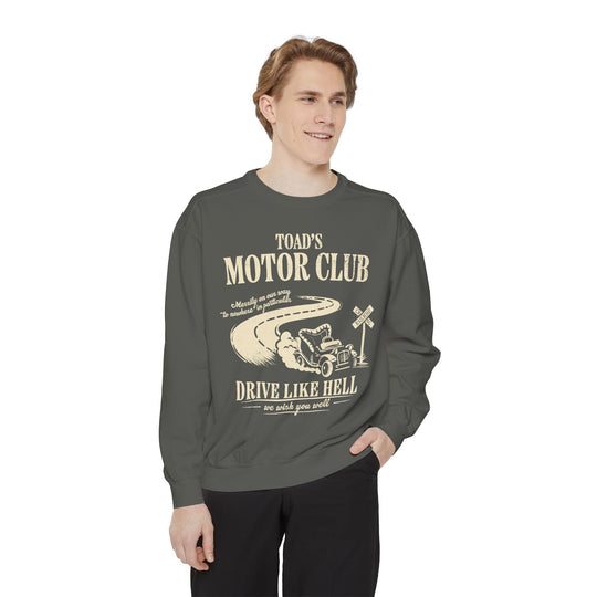 Mr. Toad's Wild Ride Sweatshirt in Pepper worn by a smiling young man, showing the Toad's Motor Club roadster design