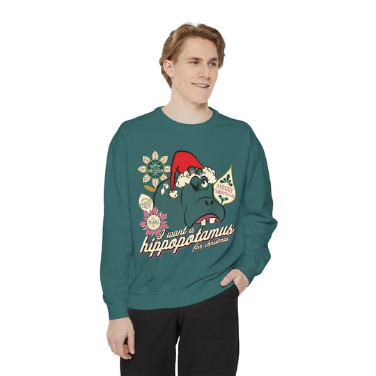 Christmas Hippo Sweatshirt in Blue Spruce worn by a man in black pants, front view of the Santa hat hippo