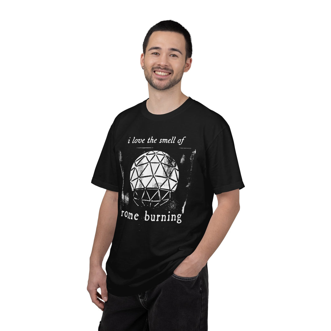 I Love The Smell of Rome Burning Tee in Black worn by a smiling man in black jeans, angled front view