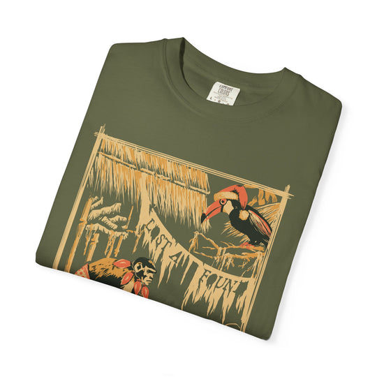 Folded close-up of the White Elephant Party shirt print, a monkey and toucan under a thatched roof