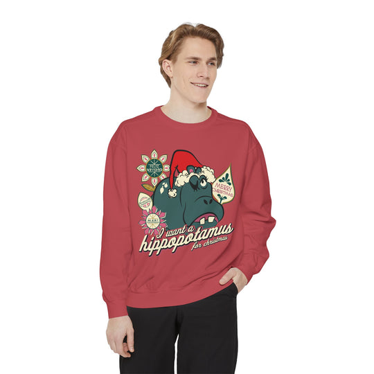 Christmas Hippo Sweatshirt in Crimson worn by a man in black pants, front view of the I Want a Hippopotamus print