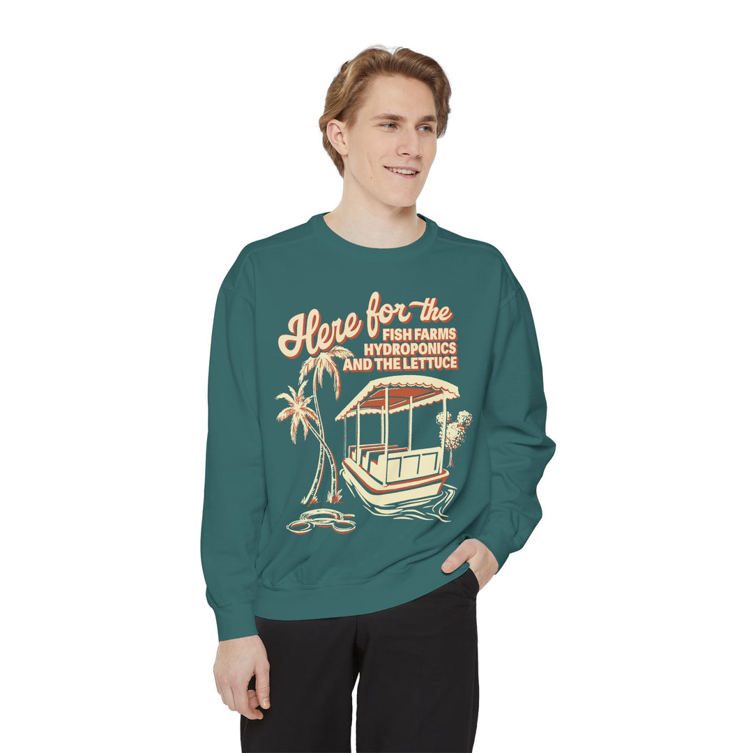 Living with the Land Hydroponics Sweatshirt in Blue Spruce worn by a smiling man, front view of the boat print