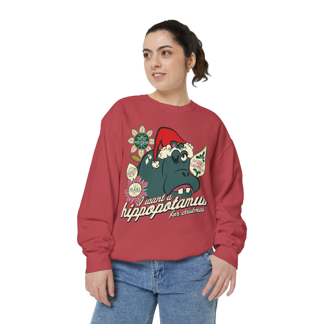 Christmas Hippo Sweatshirt in Crimson worn by a woman in jeans, three-quarter view of the Small World hippo print