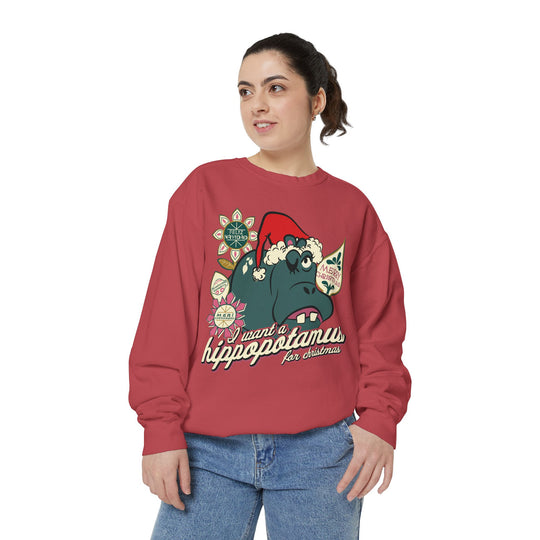Christmas Hippo Sweatshirt in Crimson worn by a woman in jeans, three-quarter view of the Small World hippo print