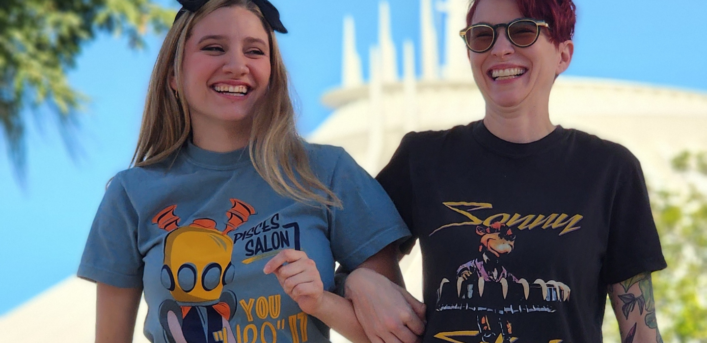 Two people in front of Space Mountain with Quirky Mouse Tshirts on