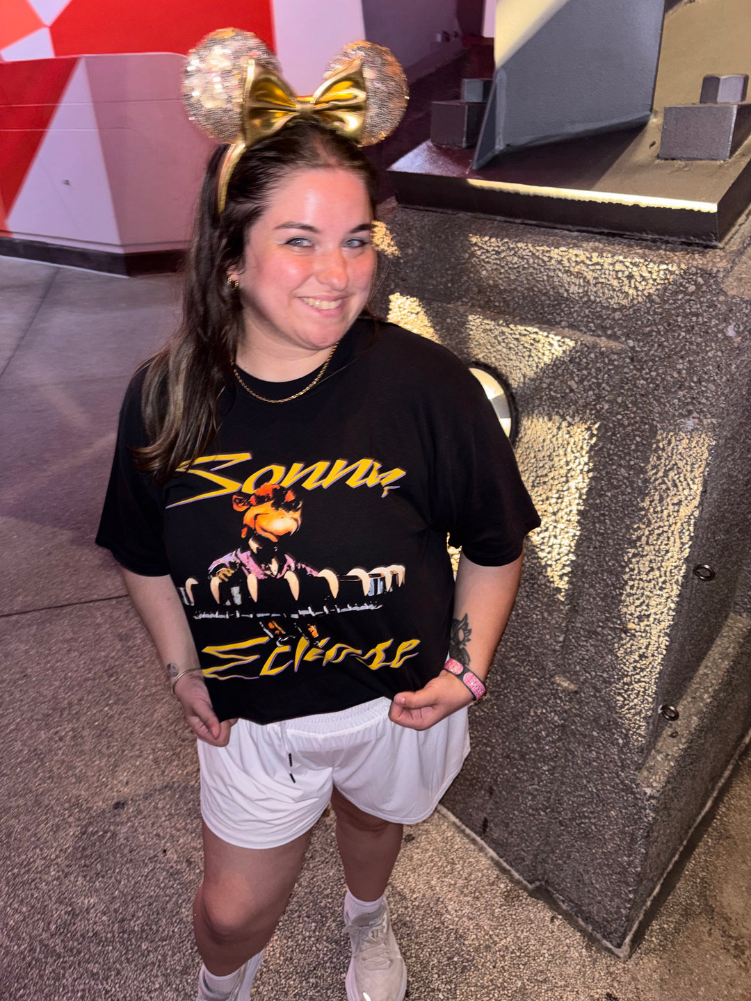 Sonny Eclipse Tee worn by a woman in sparkly Minnie ears and white shorts, standing in Tomorrowland