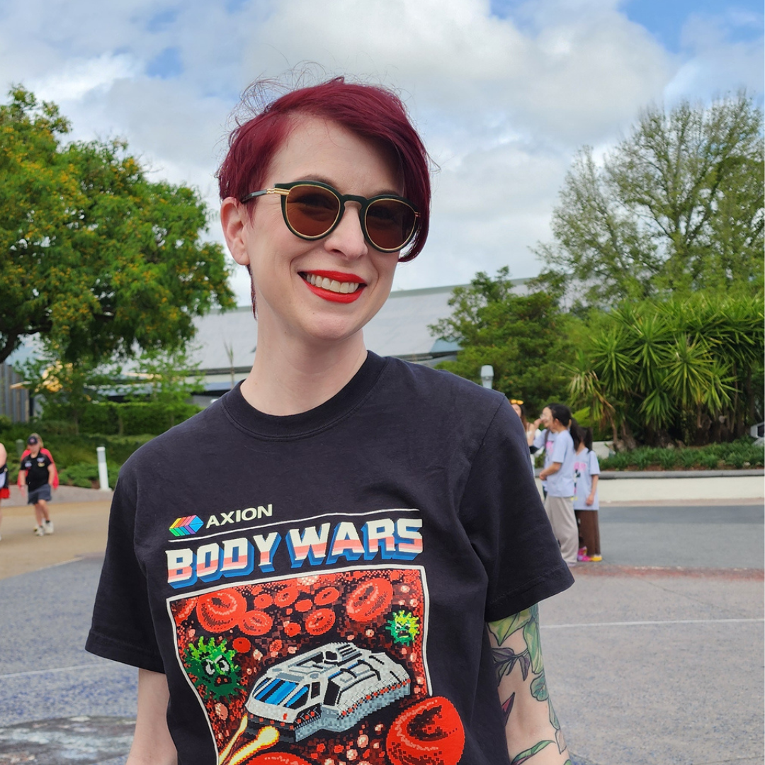 Disney fan wearing a Quirky Mouse tee in the park
