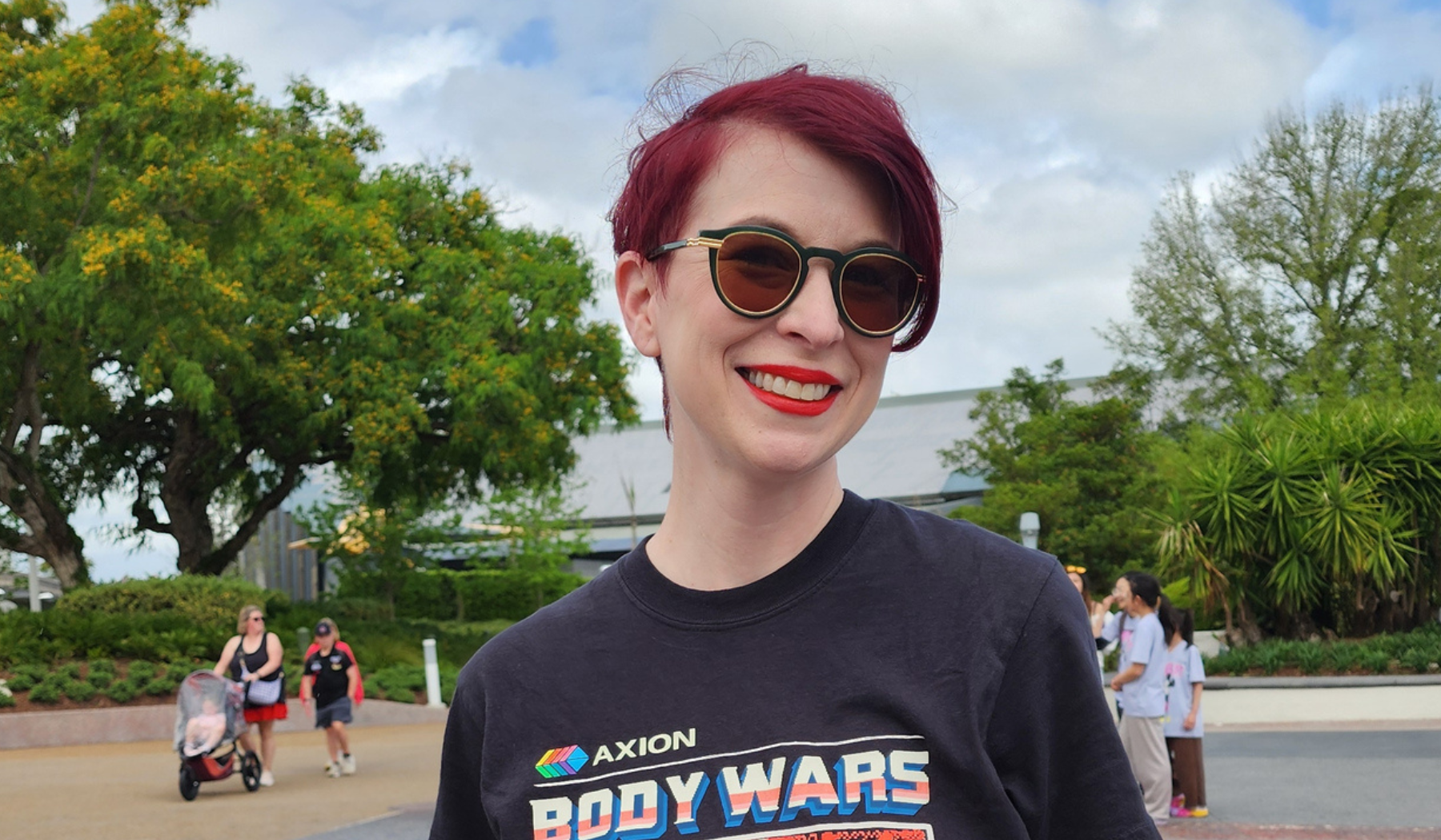 Disney fan wearing a Quirky Mouse tee in the park